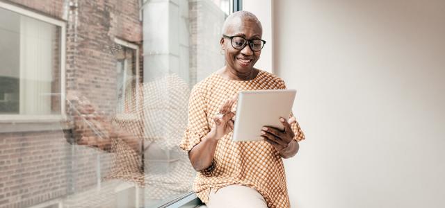 woman-scrolling-on-a-tablet
